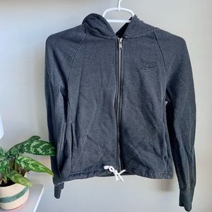 Slightly cropped Reebok zip up! Good sized hoodie, as well!